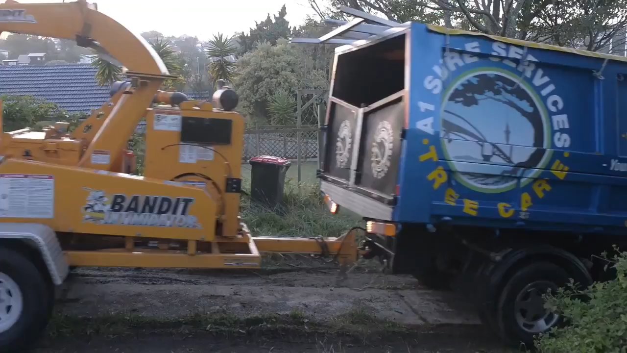 A1 Sure Services chipper clearing green waste on site